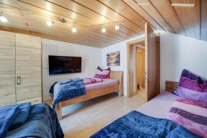 Postel nebo postele na pokoji v ubytování Ferienhaus Heidi