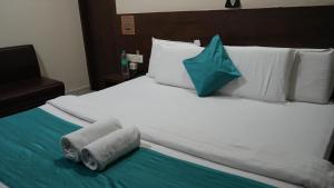 Ένα ή περισσότερα κρεβάτια σε δωμάτιο στο Hotel Satyug