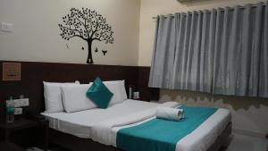 Ένα ή περισσότερα κρεβάτια σε δωμάτιο στο Hotel Satyug