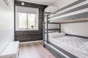 a bedroom with two bunk beds and a window at Sauna | Wi-Fi | Pets allowed | Dryer in Lofsdalen