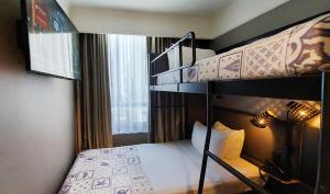 a bedroom with two bunk beds in a room at Pestana Park Avenue in New York