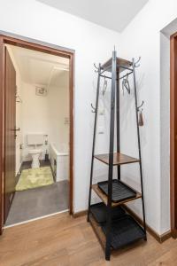 a bathroom with a ladder in a room with a toilet at Peak Moments - by myNests in Aich