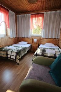 Postel nebo postele na pokoji v ubytování Päeva Villa