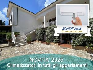 a picture of a house with a hand holding a camera at Appartamenti Adriana di ArgonautiVacanze in Porto Azzurro