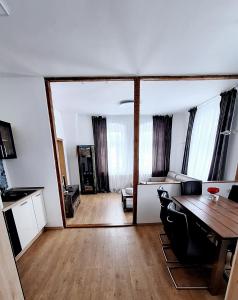 a kitchen and dining room with a table and chairs at Ferienwohnung Annaberg-Buchholz,5 in Annaberg-Buchholz