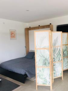 Postel nebo postele na pokoji v ubytování Studio Mimosa