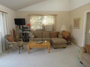 a living room with a couch and a coffee table at Lagoon Front Home In Harvey Cedars in Harvey Cedars