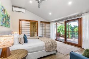 Ένα ή περισσότερα κρεβάτια σε δωμάτιο στο Cape Byron Retreat Byron Bay +69 φωτογραφίες