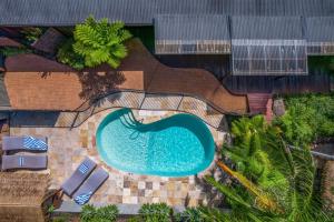 an overhead view of a swimming pool at a resort at Cape Byron Suite 5 Private Suite with Ensuite in Byron Bay
