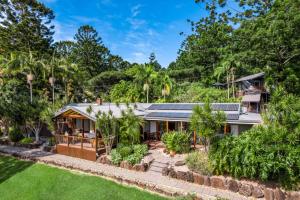 an exterior view of a house with a garden at Cape Byron Suite 5 Private Suite with Ensuite in Byron Bay