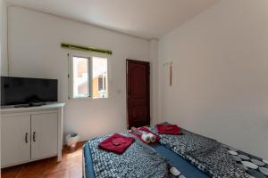 Postel nebo postele na pokoji v ubytování Casa Resi