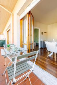 a living room with a bench and a table at Wellness Apartment 25 min to Florence WiFi, Terrace in Montecatini Terme