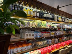 a store shelf filled with lots of bottles of drinks at Locanda di Casa Spadoni in Faenza
