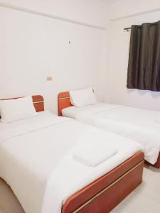 Giường trong phòng chung tại GO INN Maya - Nimman Chiang Mai