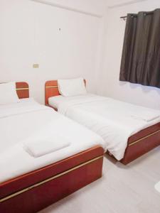 Giường trong phòng chung tại GO INN Maya - Nimman Chiang Mai