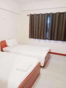 Giường trong phòng chung tại GO INN Maya - Nimman Chiang Mai