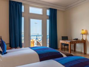 Ліжко або ліжка в номері Le Médina Essaouira Thalassa Sea & Spa - MGallery Collection