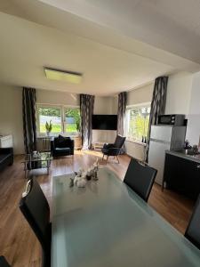 a living room with a table and chairs at Ferienhaus an der Saline in Bad Karlshafen