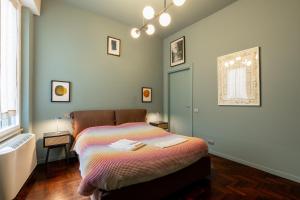 a bedroom with a bed and a window at Cairoli Suite e Garage in Milan