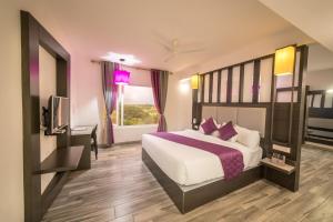 Postel nebo postele na pokoji v ubytování Hotel Visakka Palani