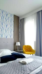 Posteľ alebo postele v izbe v ubytovaní Willa Długa No. 4 Bed & Breakfast