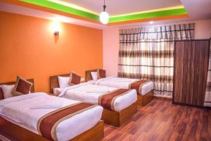 Letto o letti in una camera di Kathmandu Peace Hotel