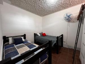 Postel nebo postele na pokoji v ubytování Little House Panajachel