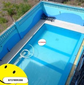 a swimming pool with a ball on top of it at Shanzu Mombasa One Bedroom & Swimming Pool in Shanzu
