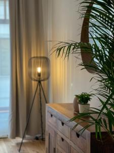 a room with a desk with a lamp and a plant at Powder Tower Residence in Prague