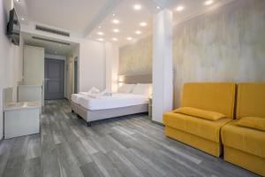 Postel nebo postele na pokoji v ubytování Hotel Villa Paradiso Suite