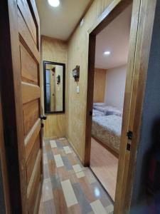 Katil atau katil-katil dalam bilik di Cabaña Temuco buena ubicación