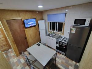 Dapur atau dapur kecil di Cabaña Temuco buena ubicación