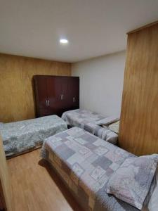 Katil atau katil-katil dalam bilik di Cabaña Temuco buena ubicación