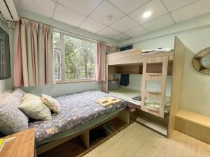 Voodi või voodid majutusasutuse AMU Dreamhouse 阿木旅舍 toas