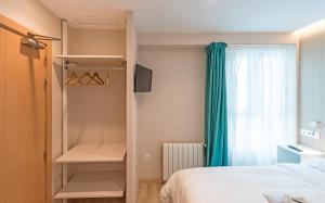 Postel nebo postele na pokoji v ubytování La Lonja