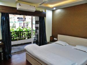 Apple Tree Apartments Koregaon Park 객실 침대