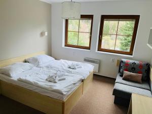Postel nebo postele na pokoji v ubytování Horský hotel Brans