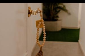 a bunch of beads hanging from a door knob at Chill Hotel Boutique - Chill Executive in Tacna