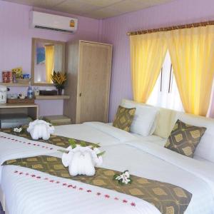 Postel nebo postele na pokoji v ubytování Phetmanee Resort