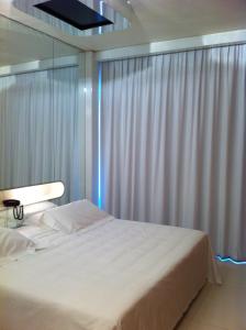 Letto o letti in una camera di i-Suite Hotel