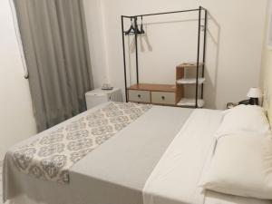 Ένα ή περισσότερα κρεβάτια σε δωμάτιο στο Palace Hotel Três Poderes