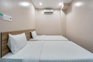 Postel nebo postele na pokoji v ubytování Hoàng Quỳnh Hotel
