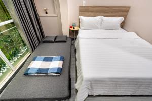 Postel nebo postele na pokoji v ubytování Hoàng Quỳnh Hotel