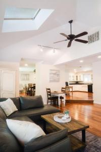 a living room with a couch and a ceiling fan at Grass Valley Home with Hot Tub in Grass Valley