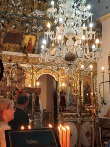 a group of people in a room with a chandelier at Angelica-Sea & Mountain View in Georgioupolis +44 photos