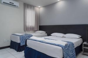 Postel nebo postele na pokoji v ubytování Ritz Praia Hotel