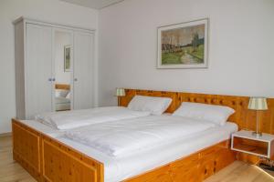 Katil atau katil-katil dalam bilik di Ferienwohnung Schloss Kirchham