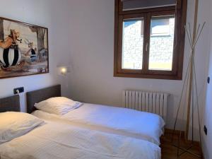a bedroom with two beds and a window at Appartement à Ordino - HUT 8270 in Ordino