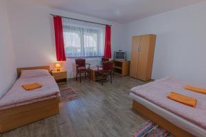 Postel nebo postele na pokoji v ubytování Penzión Bachleda