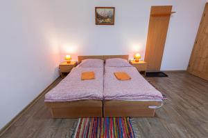 Postel nebo postele na pokoji v ubytování Penzión Bachleda